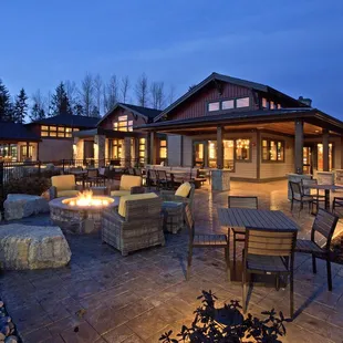 a patio with a fire pit