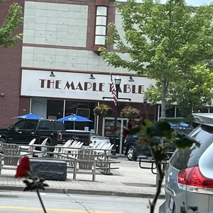 Couple tables outside seating, on the &quot;Town Square&quot; Monument park