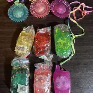 Old blinking led necklaces from years ago. Blackberry cellular phone and flowers