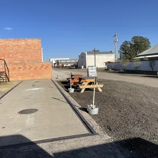 Tables &amp; short steps up to the cool tasting room and pay phone