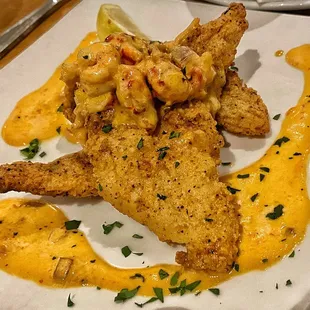 Fresh (and I mean FRESH) fried catfish with a crawfish sauce. Heavenly! Comes with roasted fingerling taters and a salad of your choice.