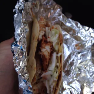 It's like a soft shell taco with a layer of retries beans on a hard taco and Cajun spiced fish with chipotle sauce.