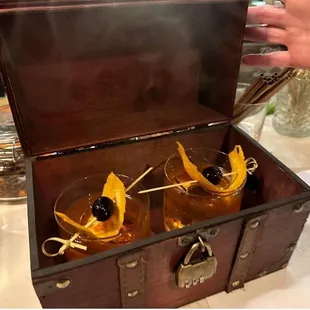 two cocktail glasses in a trunk