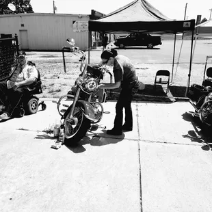 a man working on a motorcycle