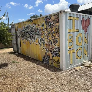 a container with graffiti on it