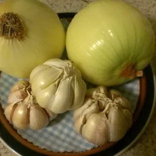 They pre-clean some of their produce. The outer skins on these onions and garlic have been removed by them! :)