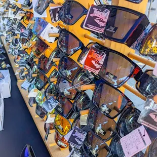 a wall of sunglasses