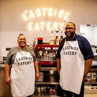 two people in aprons