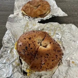 Sausage egg and cheese bagel and a sausage egg and cheese croissant