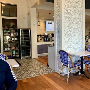 View towards the front, ordering counter and wine chiller and local boutique items