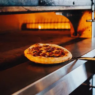 a pizza being cooked in an oven