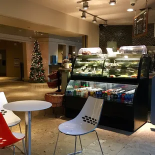 a bakery with a christmas tree in the background