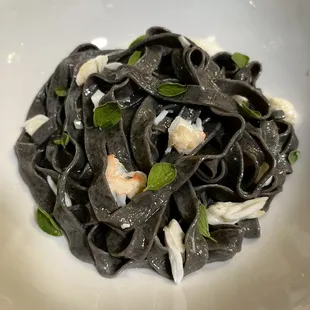 homemade from scratch: Fresh Squid Ink Fettuccine w/ King Crab in a garlic butter sauce w/ fresh oregano leaves and a squeeze of lemon juice