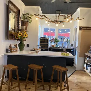 a counter with three stools