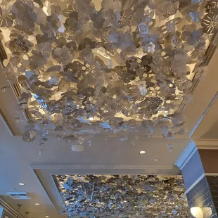 a ceiling covered in paper flowers