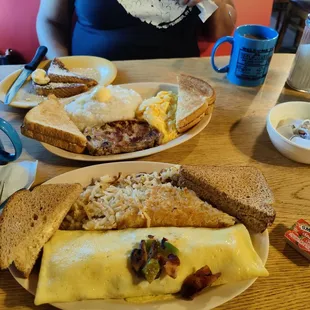French toast, eggs, grits, pork chops, western omelette, hash browns and toast.