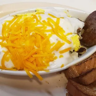 The boat special - homefries top with eggs, gravy and cheese with side of sausage and toast ~$6.95