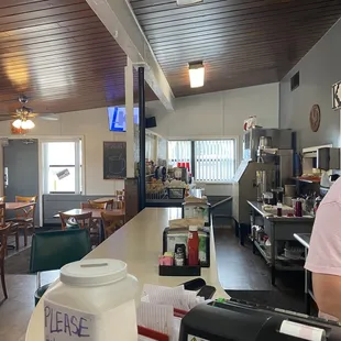 a woman standing at the counter