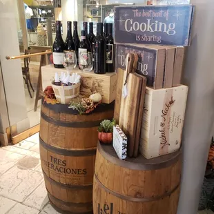 a display of wine bottles and other items