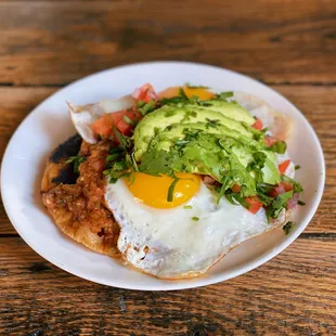 a plate of food on a wooden table