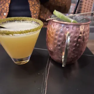 two cocktails on a table