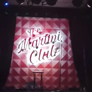 a stage with a chair in front of it