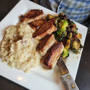 Pork tenderloin, garlic mashed, crispy seasoned brussels sprouts.