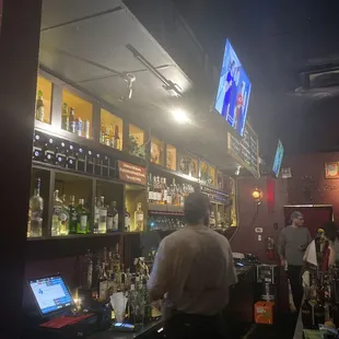 a man standing at a bar