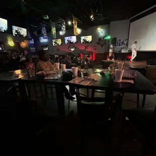 a group of people sitting at a bar