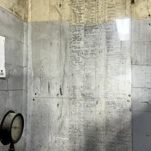 The wall with the handwritten schedules when it was first opened on 8/15/1927. It was made to be a theatre for plays and musicals