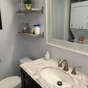 Half bathroom and washer dryer