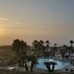 Sunrise view from pation. Beach is just beyond pools.