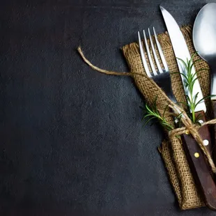 a knife and fork wrapped in burlock