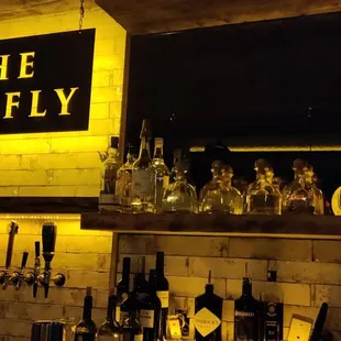 a bar with bottles of alcohol