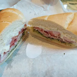 House baked sourdough roll with Black Forest ham, Brie cheese, house made pesto, mayonnaise, tomato, red onion, and sprouts!!