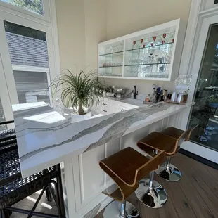 Inside the house. A bar area.