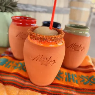 three jars with a drink in them