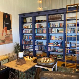 a living area with bookshelves