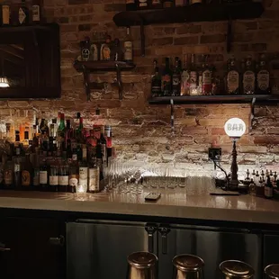 a bar with a brick wall