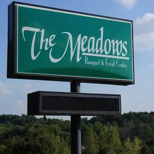 outdoor sign for The Meadows