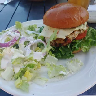 Cali Chicken sandwich. Pesto sauce, chicken, cheese, lettuce and tomato on a roll.
