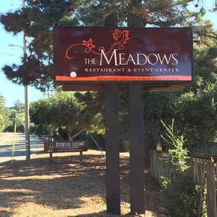 a sign for the meadows