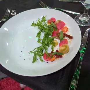 Vegan dinner event- 2nd course- (what's left) salad w/ cheez spread, heirloom tomato, arugula, picked radish, Tunisian lemon oil, &amp; harissa