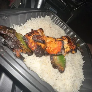 a tray of rice and vegetables