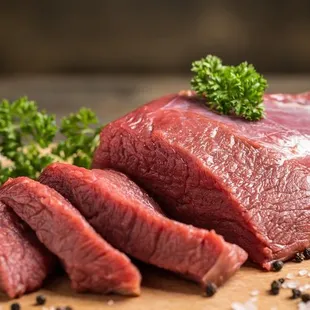 a piece of beef on a cutting board