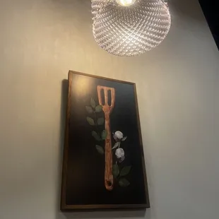 a painting of a fork and flowers