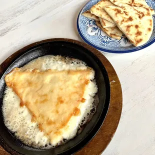 Saganaki -- A must have item in their menu.  Unbelievably good!