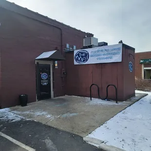 This is the entrance in the back along with the news that The Med is open for lunch!