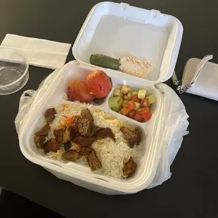 a meal in a styrofoam container