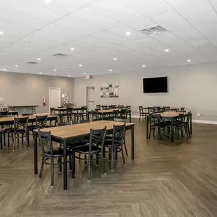 Seating area includes 9 six-foot tables, 48 chairs.